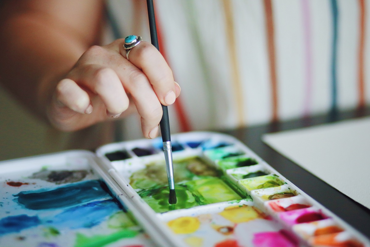 woman painting with watercolors